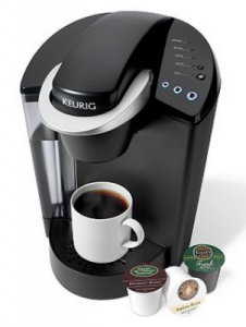 Black-Keurig-coffee-maker-with-steaming-cup-of-coffee